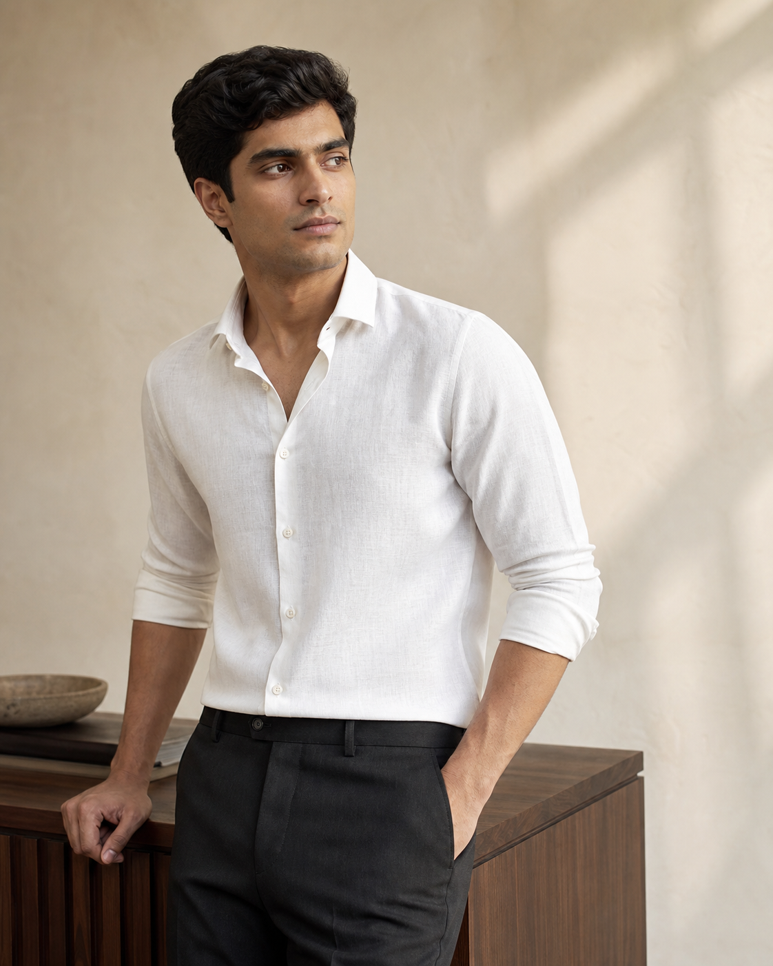 Man wearing a white linen-blend shirt in the Deva Selections atelier